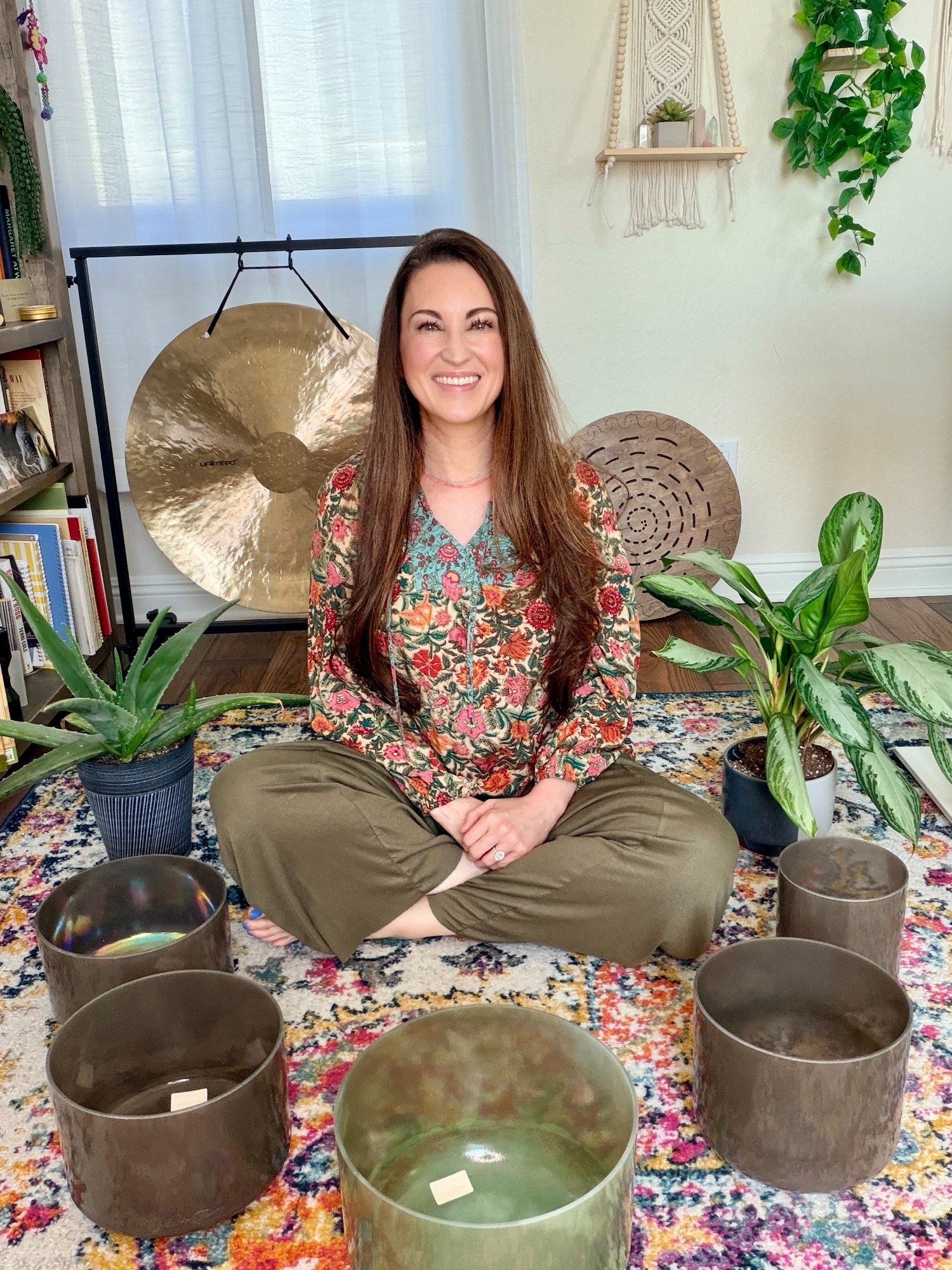 Jessie Brown, sound healing and breathwork facilitator, with crystal bowls and sound instruments in Desert Ridge, Phoenix AZ